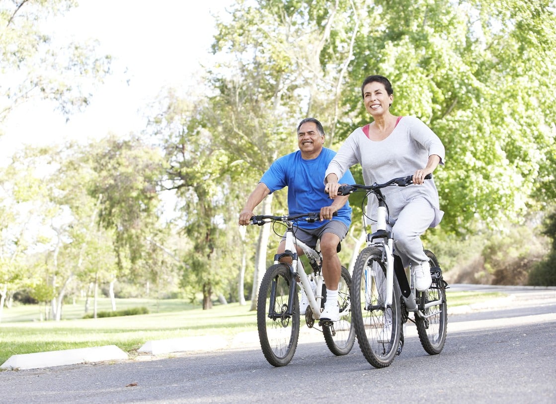 Couple riding bikes together