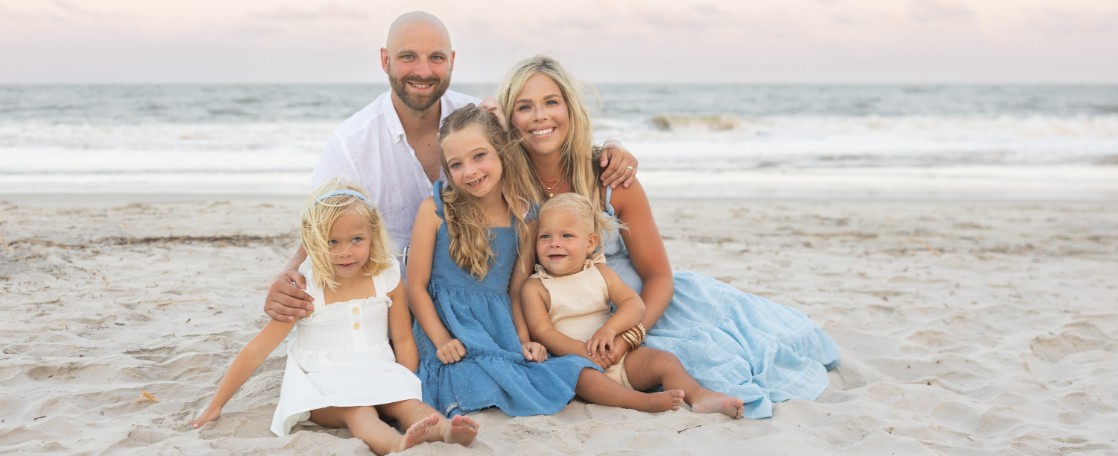 Lura Hughes and family on beach