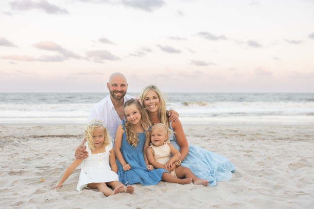 Lura Hughes with her family on the beach