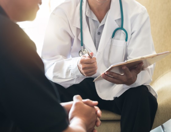 Man talking with doctor