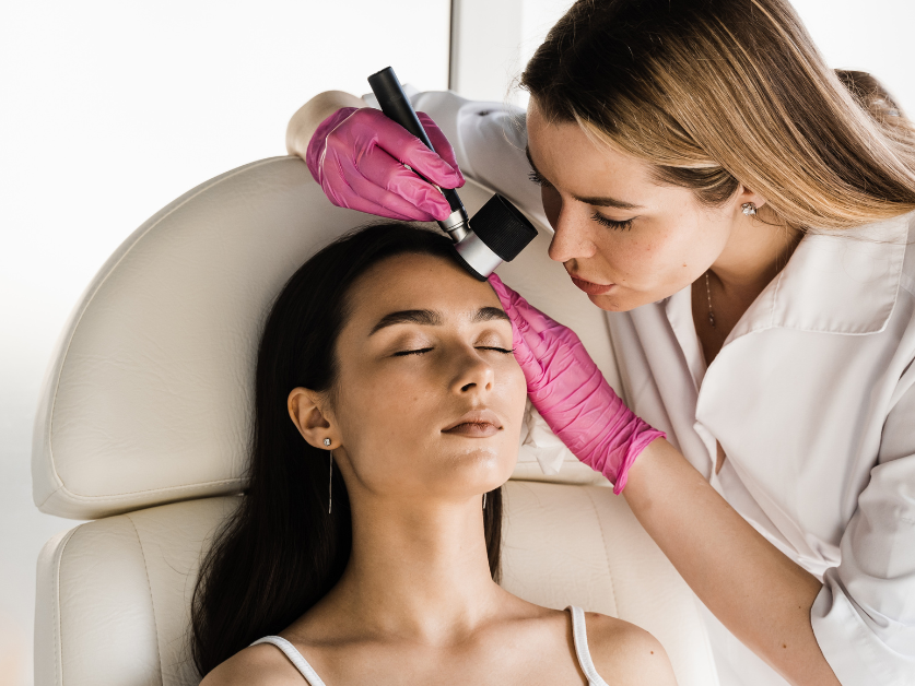 Woman getting skin checked by dermatologist